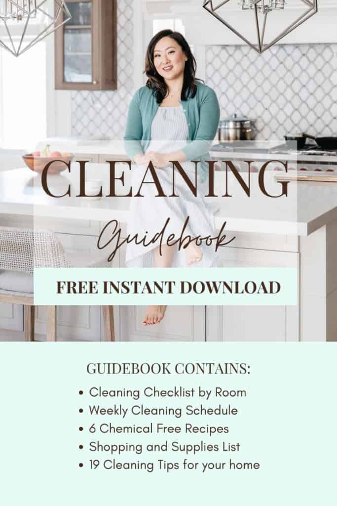 Cleaning Guidebook woman sitting on kitchen island