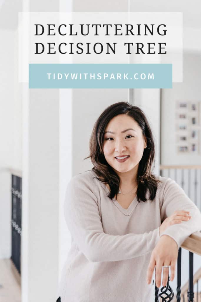 Woman leaning on stair rail Decluttering Decision Tree