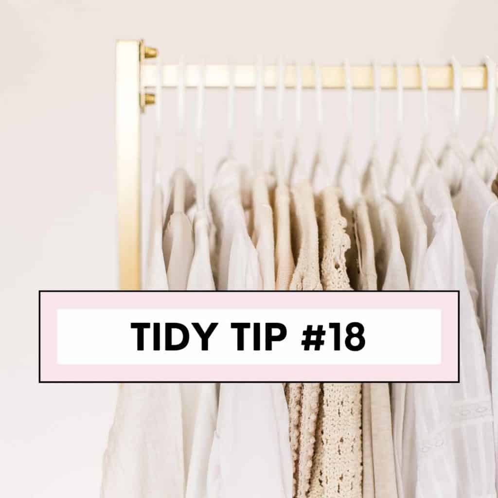 hanging clothes on gold clothing rack