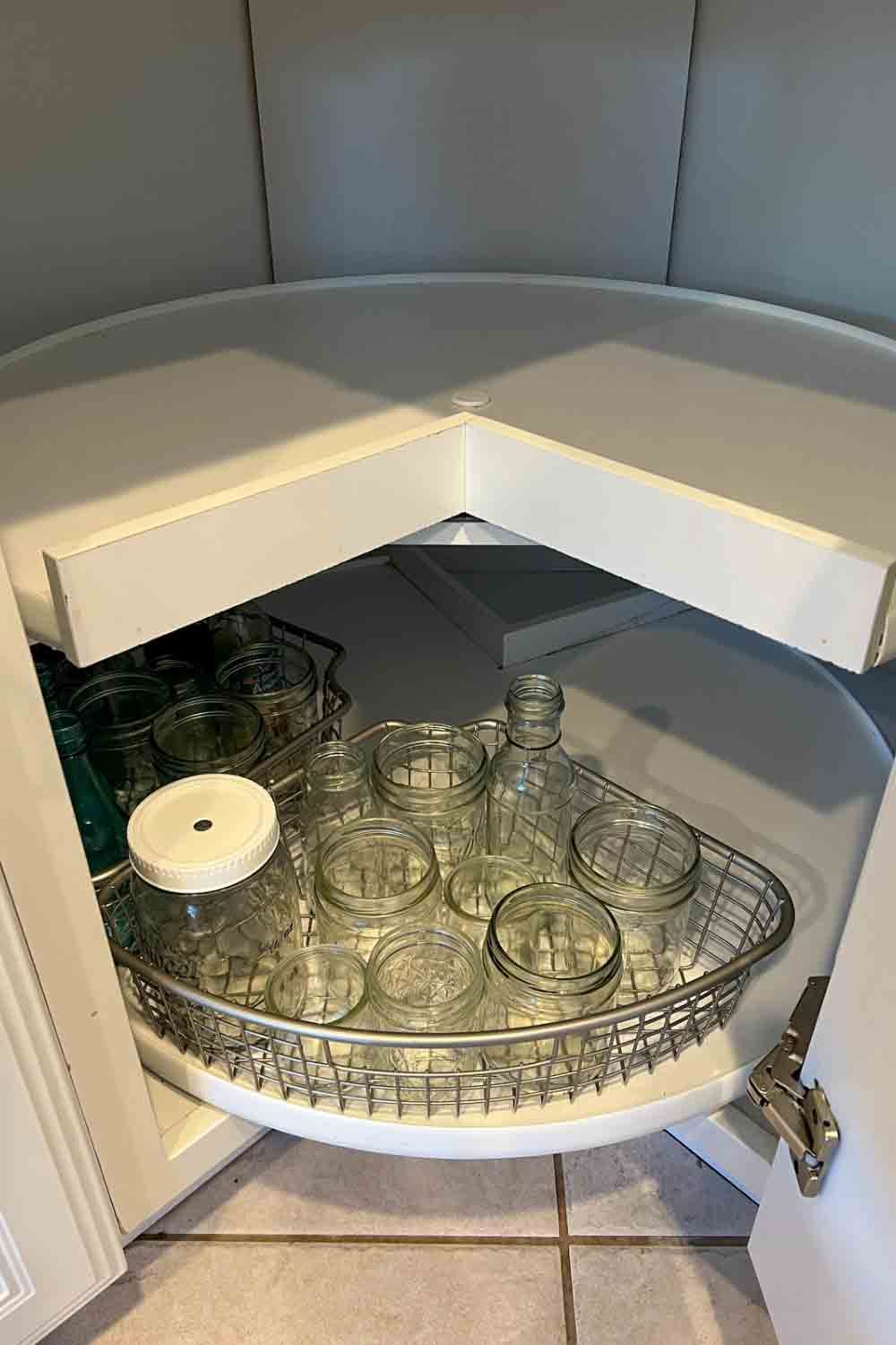 empty glassware in metal triangle organizing bin