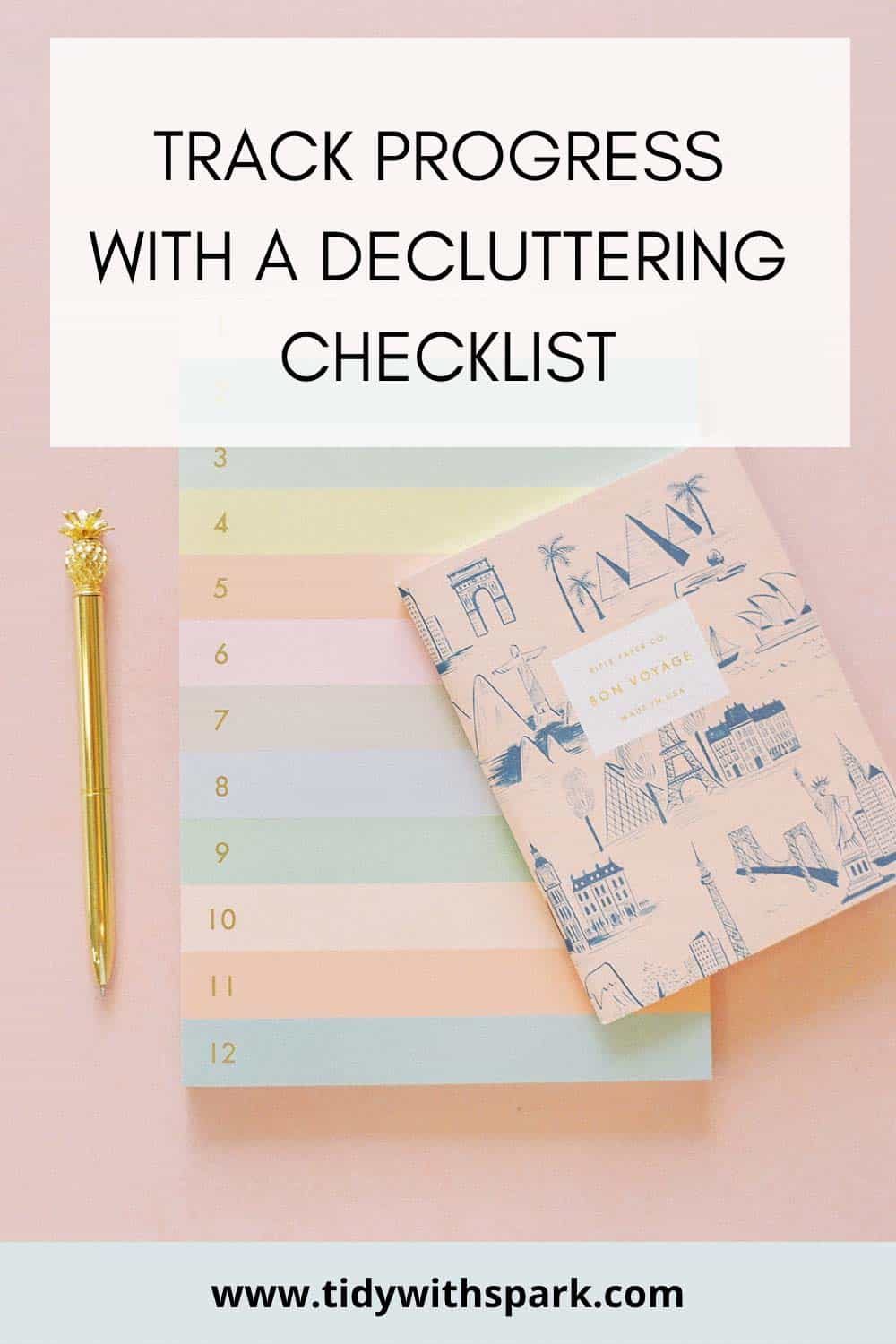 flatlay photo of calendar and checklist with pen and text overlay of "track progress with a decluttering checklist" Tidy with spark free printable decluttering checklist pdf
